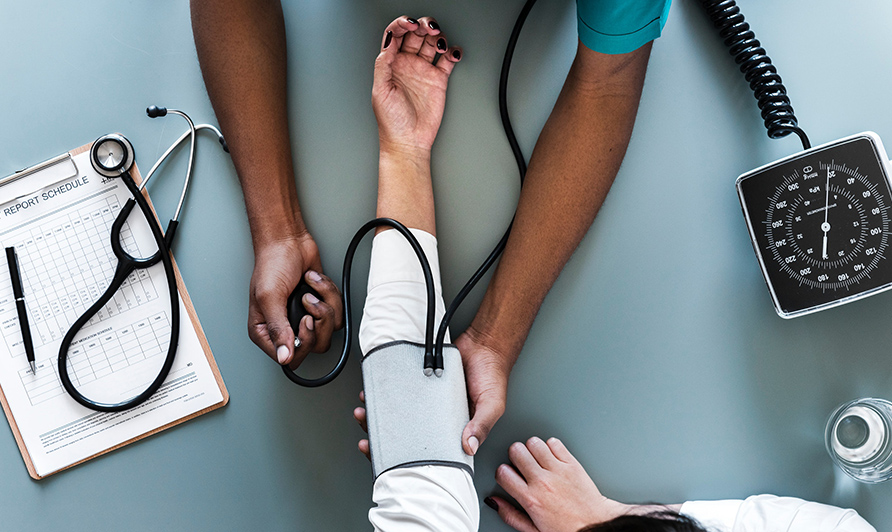 Nurse taking blood pressure